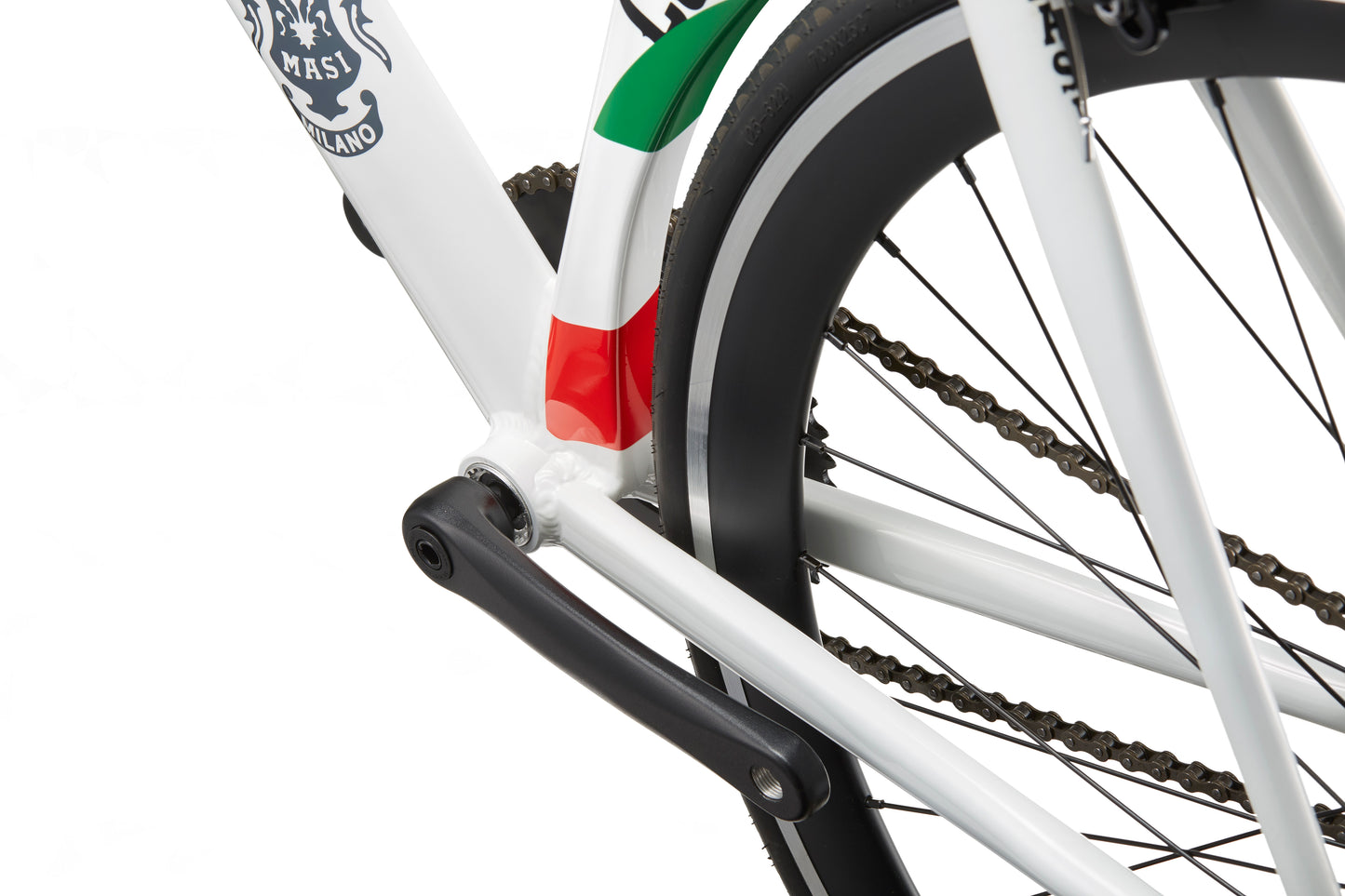 Close-up of the Coltello Geometry fixie: white frame, black chain and tire, with red, white & green accents by the rear wheel.