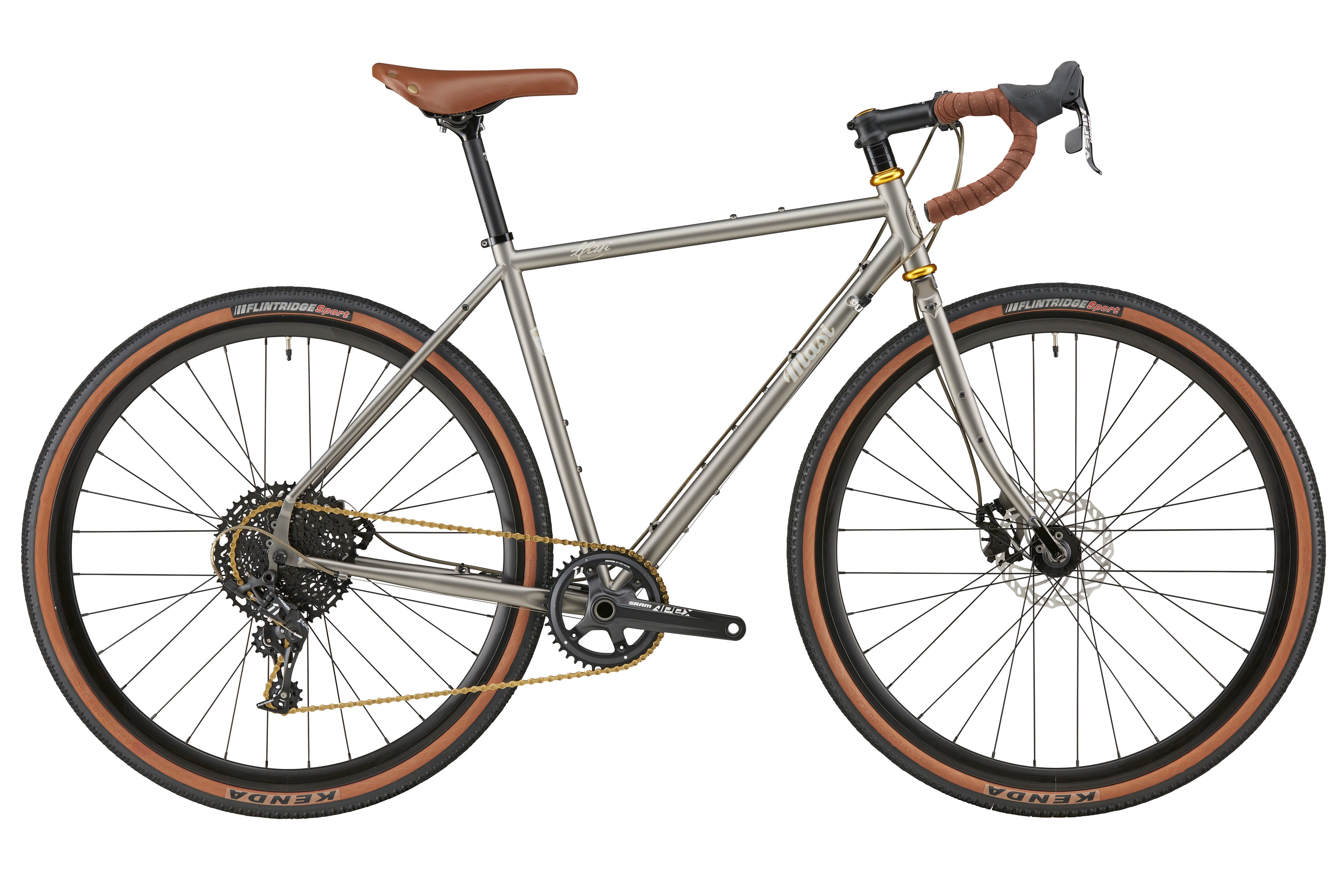 A side view of the CATALINA 1: silver gravel bike with brown handlebars, chromoly steel frame, wide tires, and disc brakes on white.