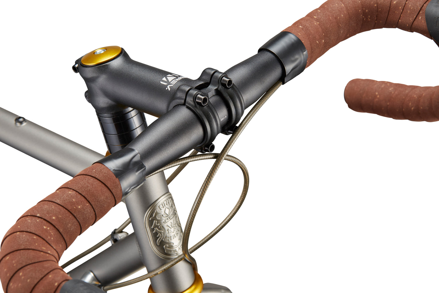 Close-up of CATALINA 1 bicycle handlebars wrapped in brown tape, with visible cables and chromoly steel frame on white background.