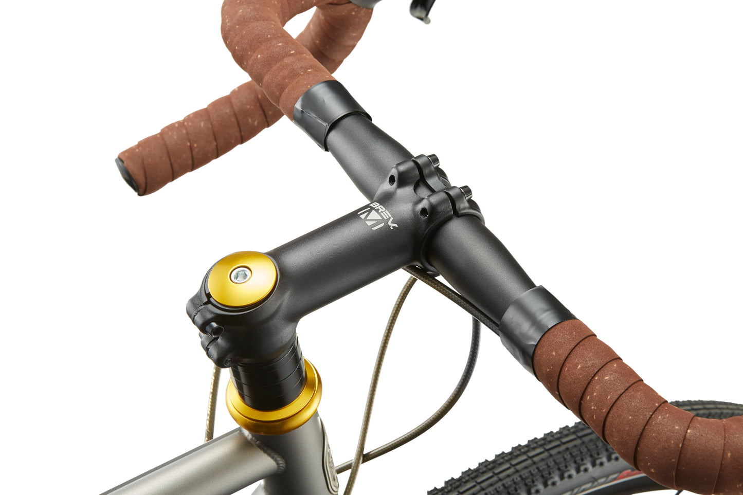 Close-up of CATALINA 1s black handlebar with brown tape, gold headset, and brake cables—showcasing Italian cycling style.