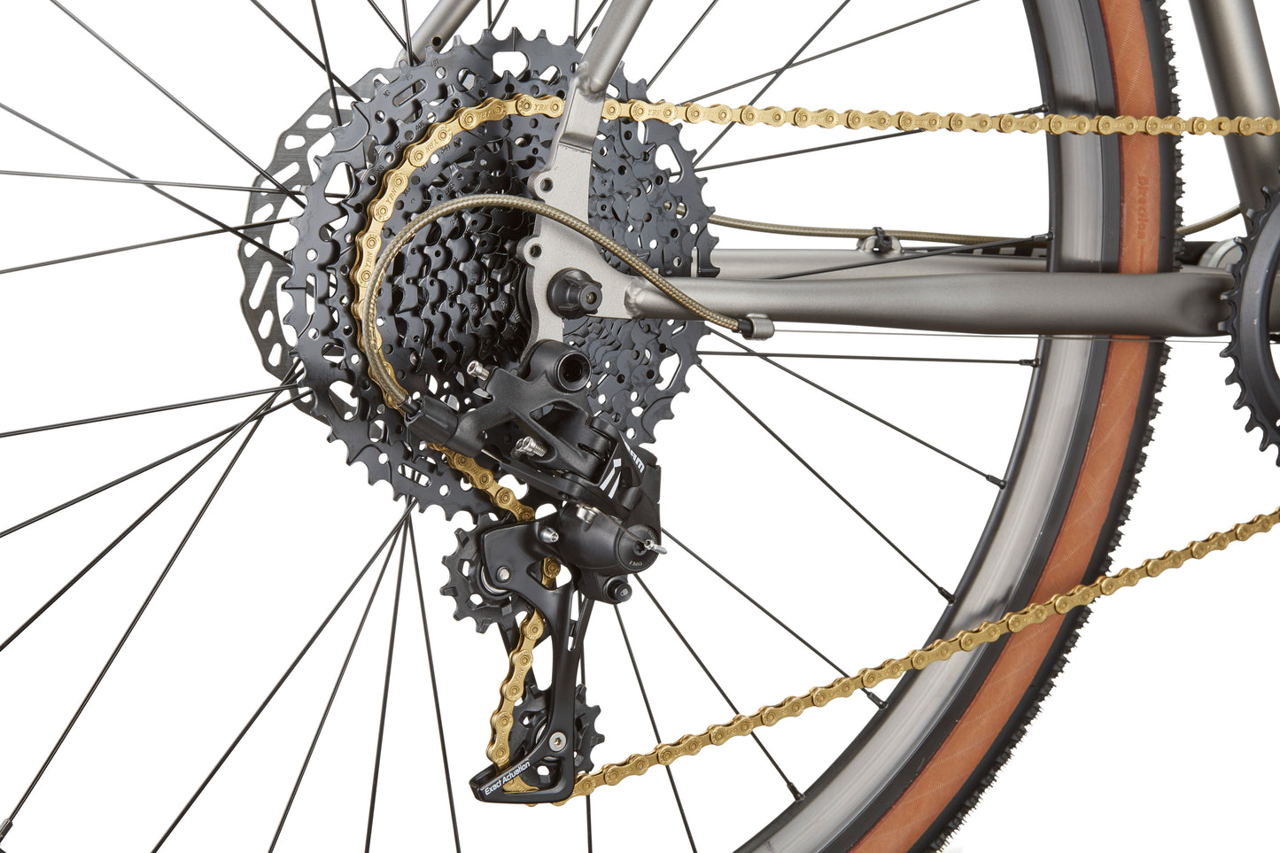 Close-up of CATALINA 1s rear wheel featuring chromoly frame, gold chain, and brown sidewall tires—classic Italian cycling style.
