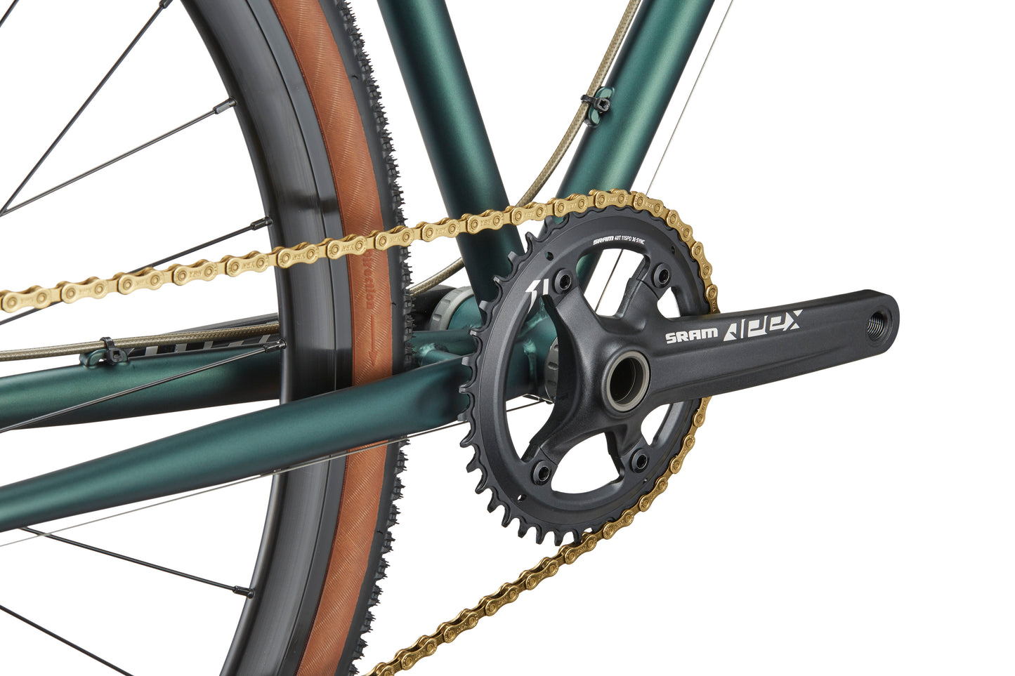 Close-up of CATALINA 1 drivetrain with gold chain, SRAM APEX crankset, and brown sidewall tire—classic Italian cycling style.