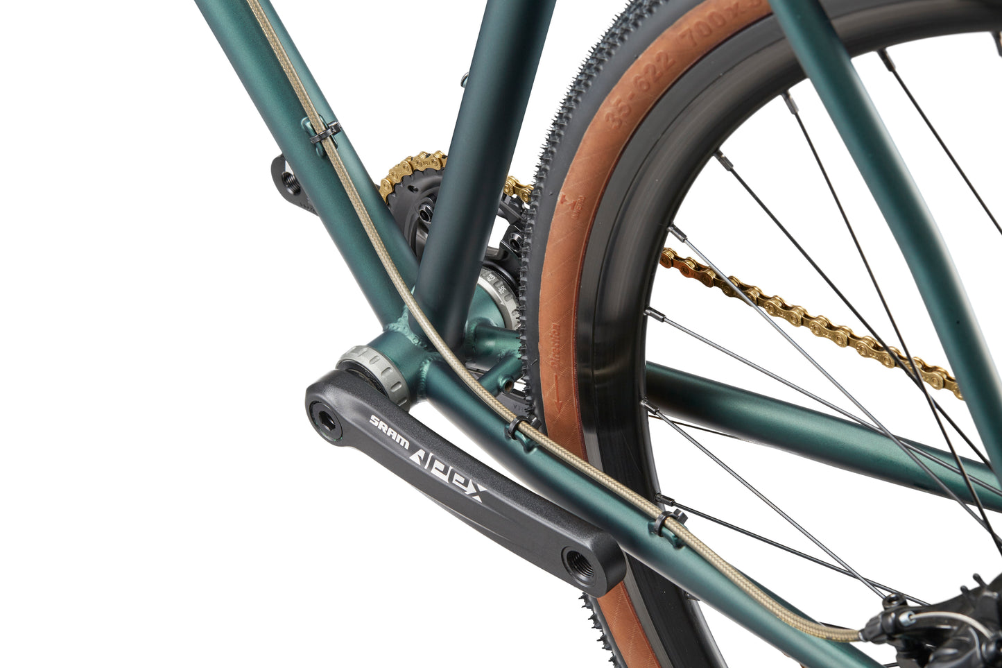 Close-up of CATALINA 1s rear wheel: green chromoly steel, tan-walled tire, gold chain, and SRAM Apex—classic Italian cycling style.