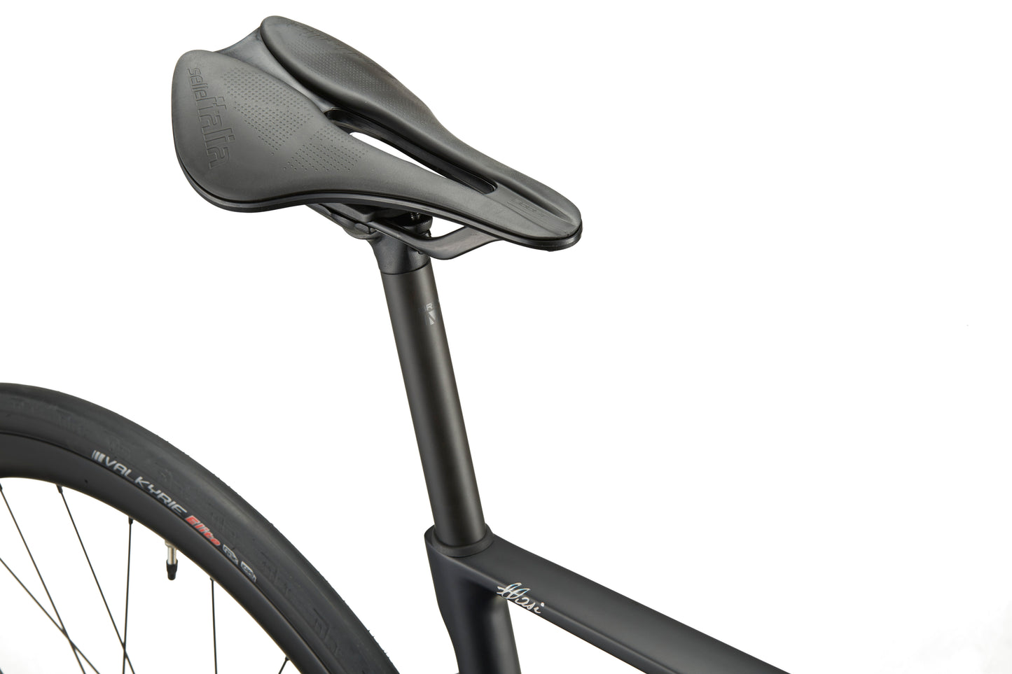 Close-up of a black seat and seat post on a GRAN CORSA carbon road bike, rear wheel shown against a white background.