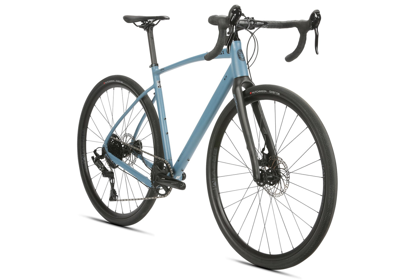 BRUNELLO ADX: Blue road bike with black handlebars, disc brakes, thin tires, aluminum gravel frame, and full carbon fork on white background.