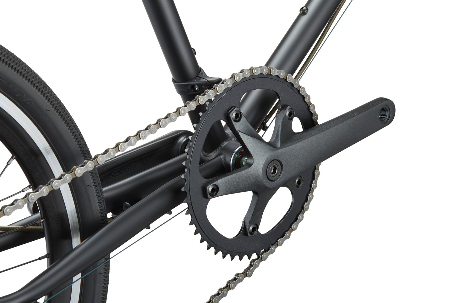 Close-up of the STELVIO 3 MiniVelo crankset, chainring, and chain exudes urban sophistication on a white background.