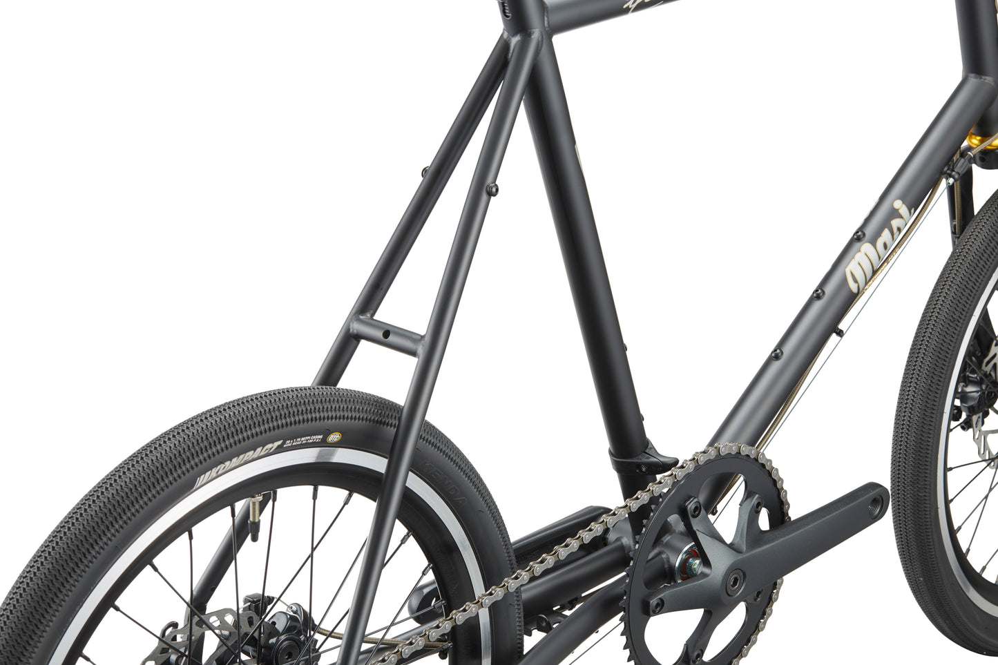 Close-up of the STELVIO 3 MiniVelo’s frame, rear wheel, and crankset, highlighting urban style against a white background.