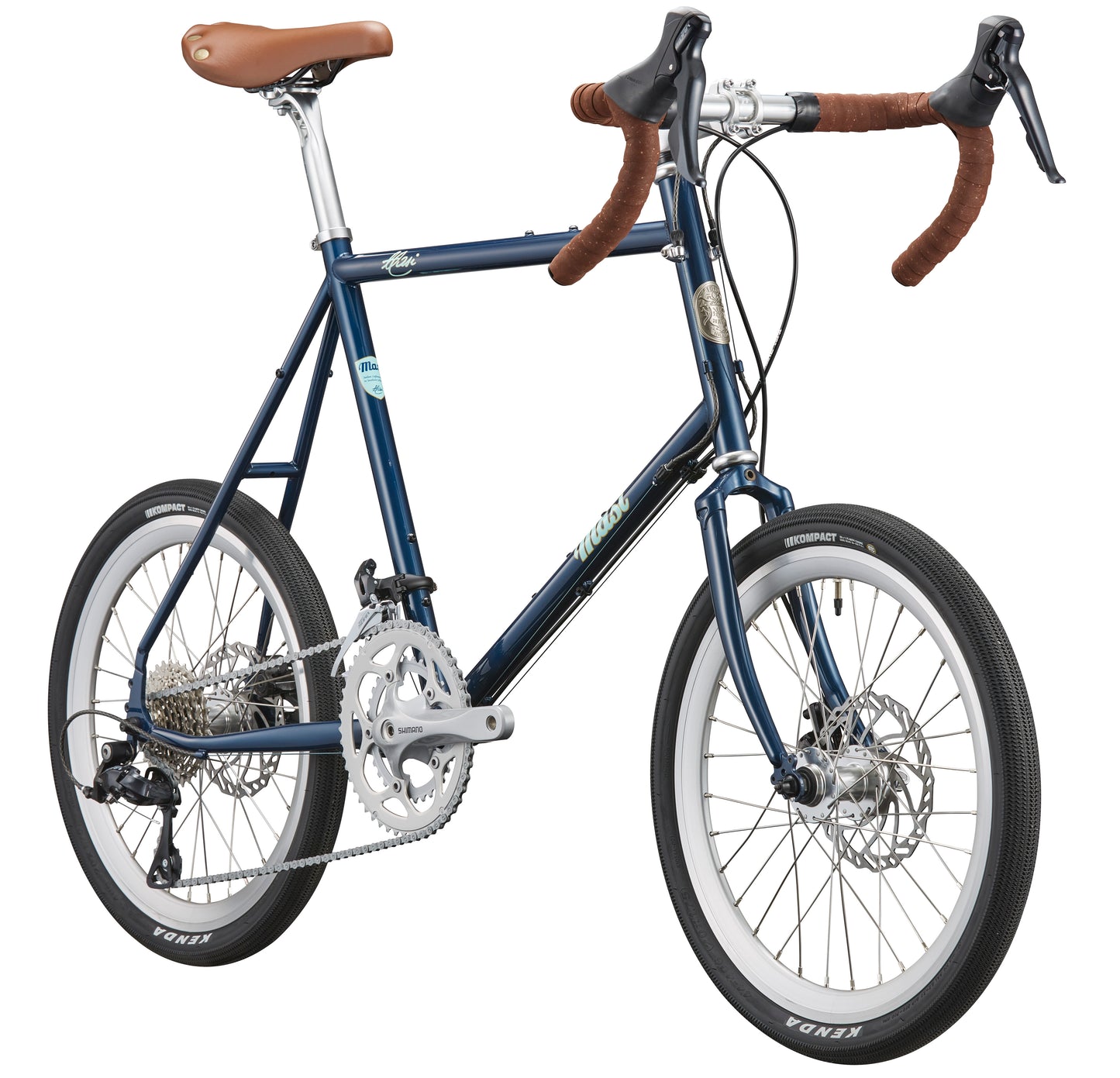 The STELVIO 1 MiniVelo, in blue with brown handlebars and seat, silver pedals, and small wheels stands out on a white background.