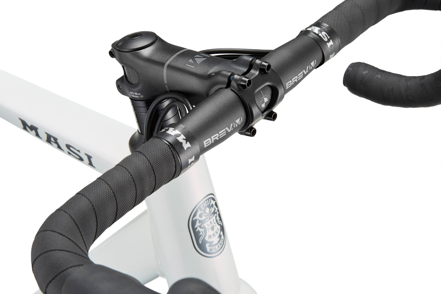 Close-up of VINCERE 3 with a black handlebar on an alloy frame, MASI text, emblem detail, and Shimano Tiagra parts.