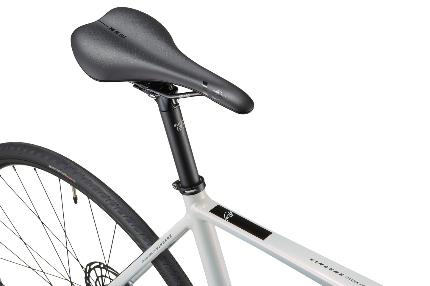 Close-up of a sleek black saddle and rear wheel on a Masi VINCERE 3 alloy frame with visible tire tread.