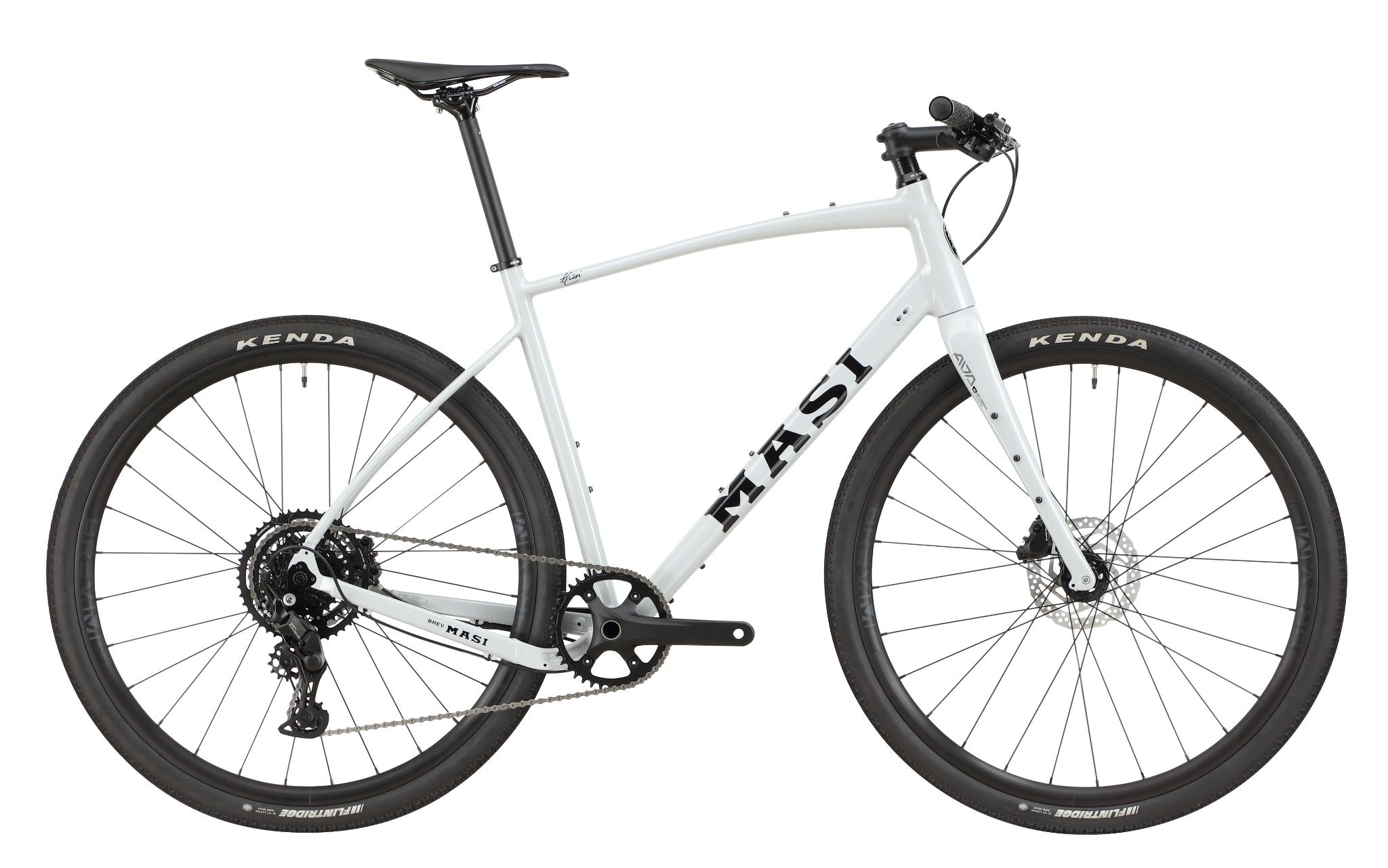 The BRUNELLO 3, a white Masi gravel bike with tubeless-ready wheels, disc brakes, and flat bars, shown side view on white.