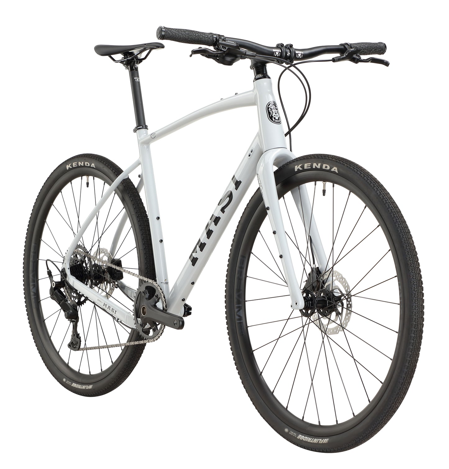 The BRUNELLO 3 is a sleek, modern white bike with black Kenda tires and disc brakes, viewed from a front-side angle on a white background.