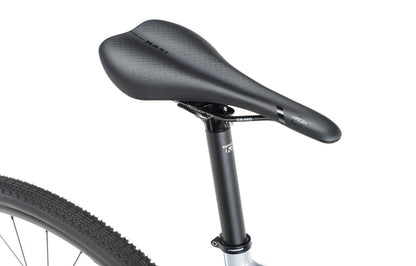 BRUNELLO 1 black saddle on a bike featuring a grey frame and textured tires, viewed from the side.