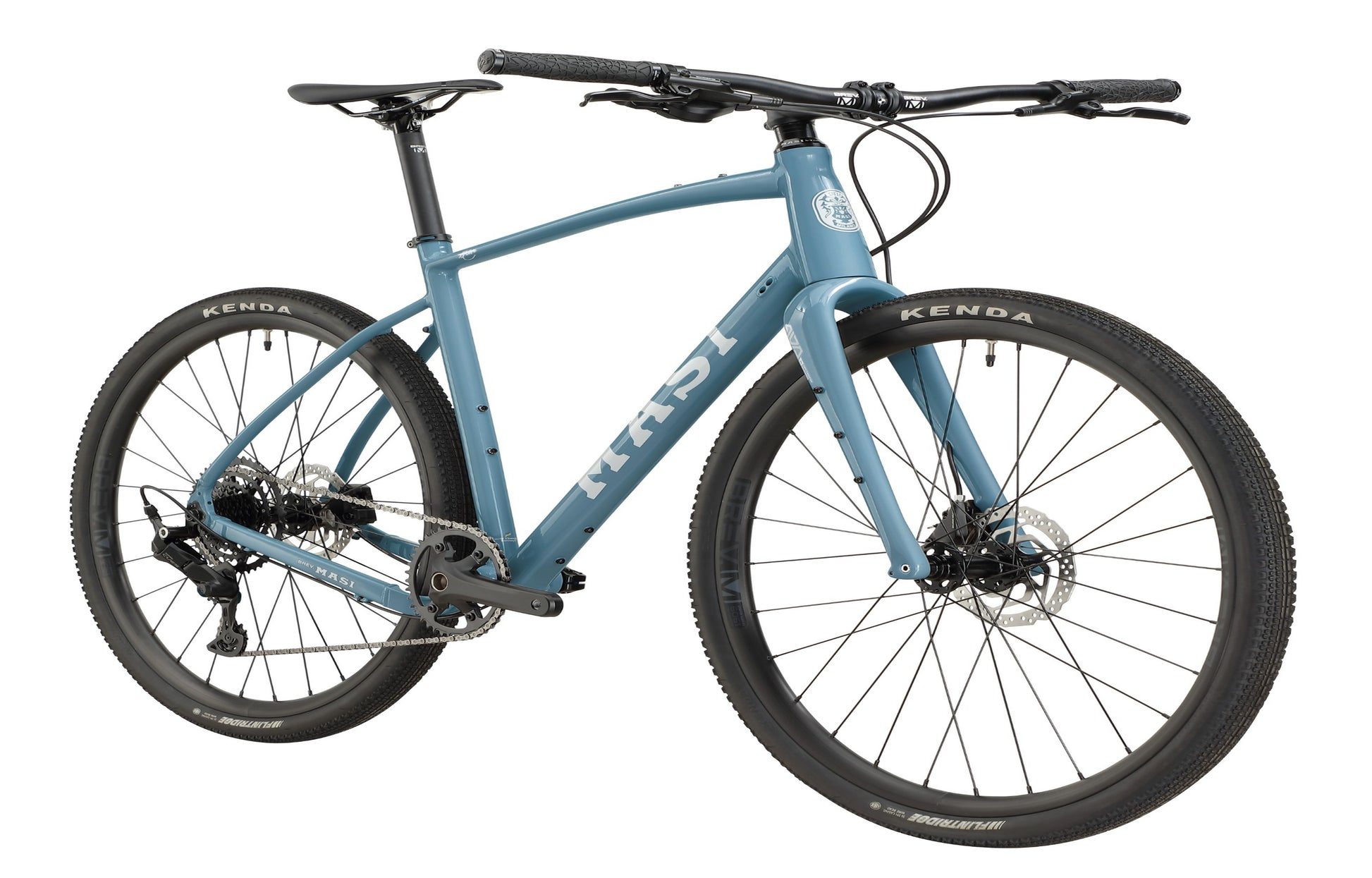 BRUNELLO 3 blue gravel bike with drop handlebars, disc brakes, and Kenda tires, front-side view on a white background.