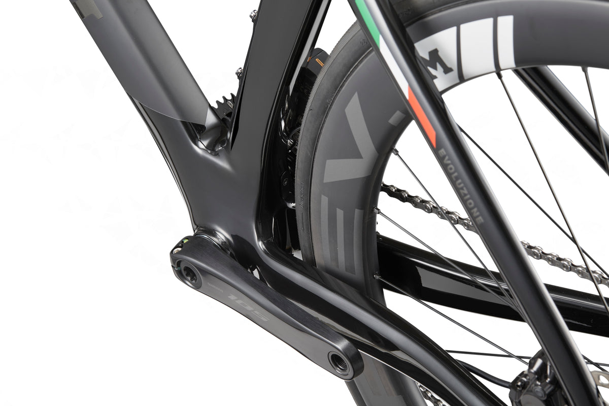 Close-up of the rear wheel and frame of a Masi EVOLUZIONE 1, highlighting its aerodynamic design and detailed tire branding.