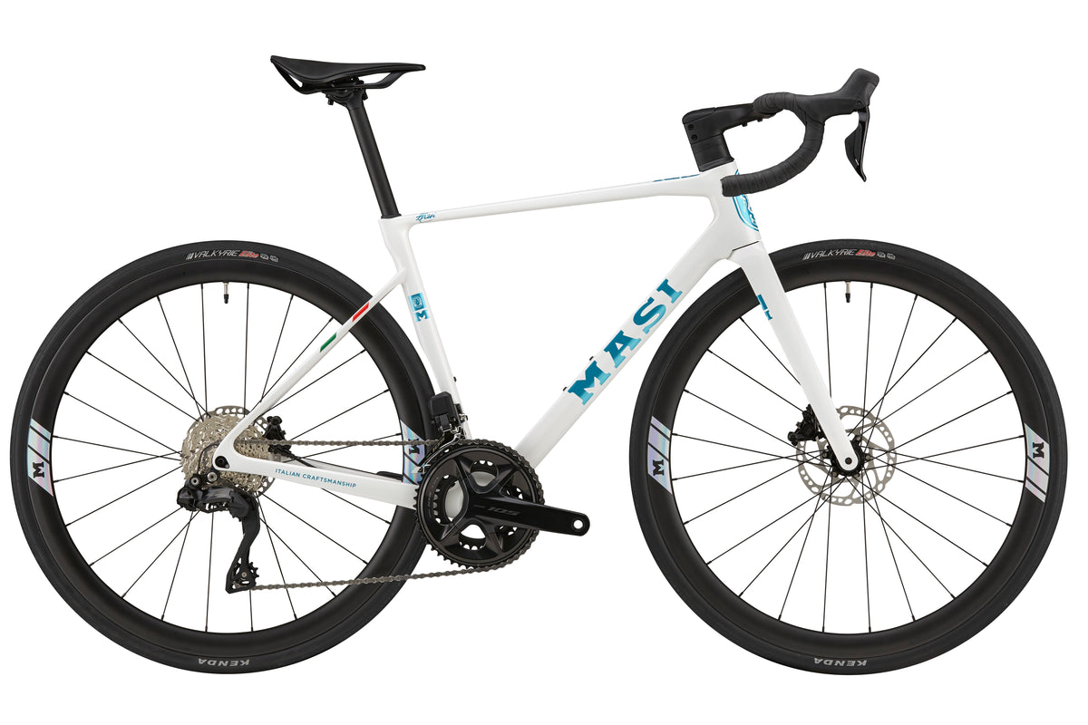 White GRAN CORSA carbon road bike with black wheels, drop handlebars, and blue MAST logo on the frame, shown from the side.